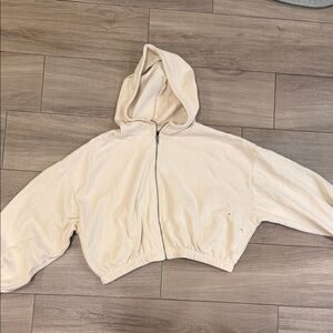 BDG cream large sweater . Few paint stains on arm